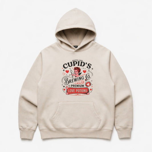 Beige hoodie with 'Beautiful Chaos Cupid's Brewing Co' graphic on a white background