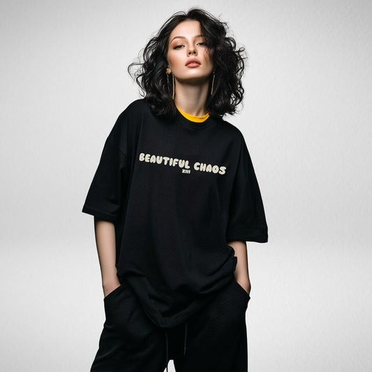 Beautiful Chaos black with butter logo printed on the front with grey background 