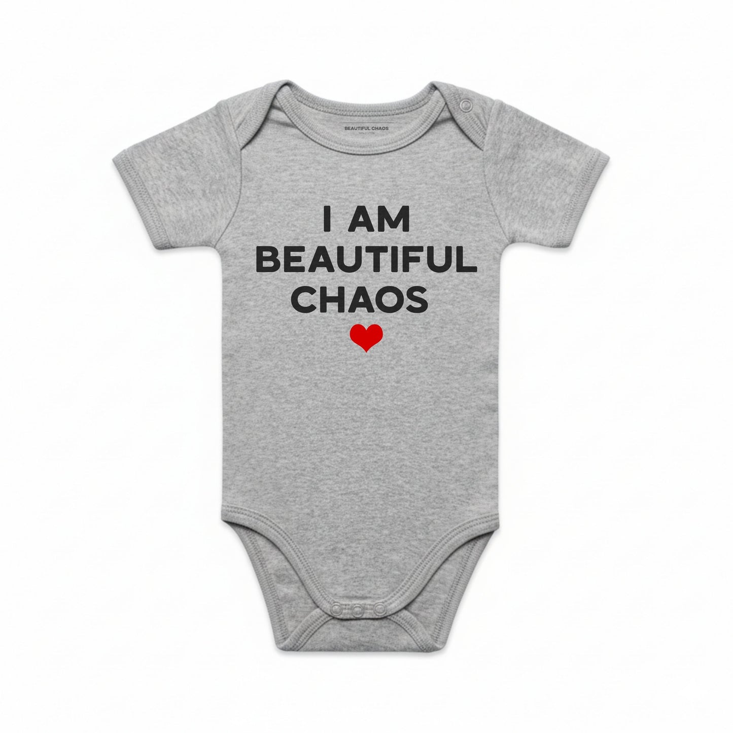 Gray baby onesie with text 'I AM BEAUTIFUL CHAOS' and a red heart