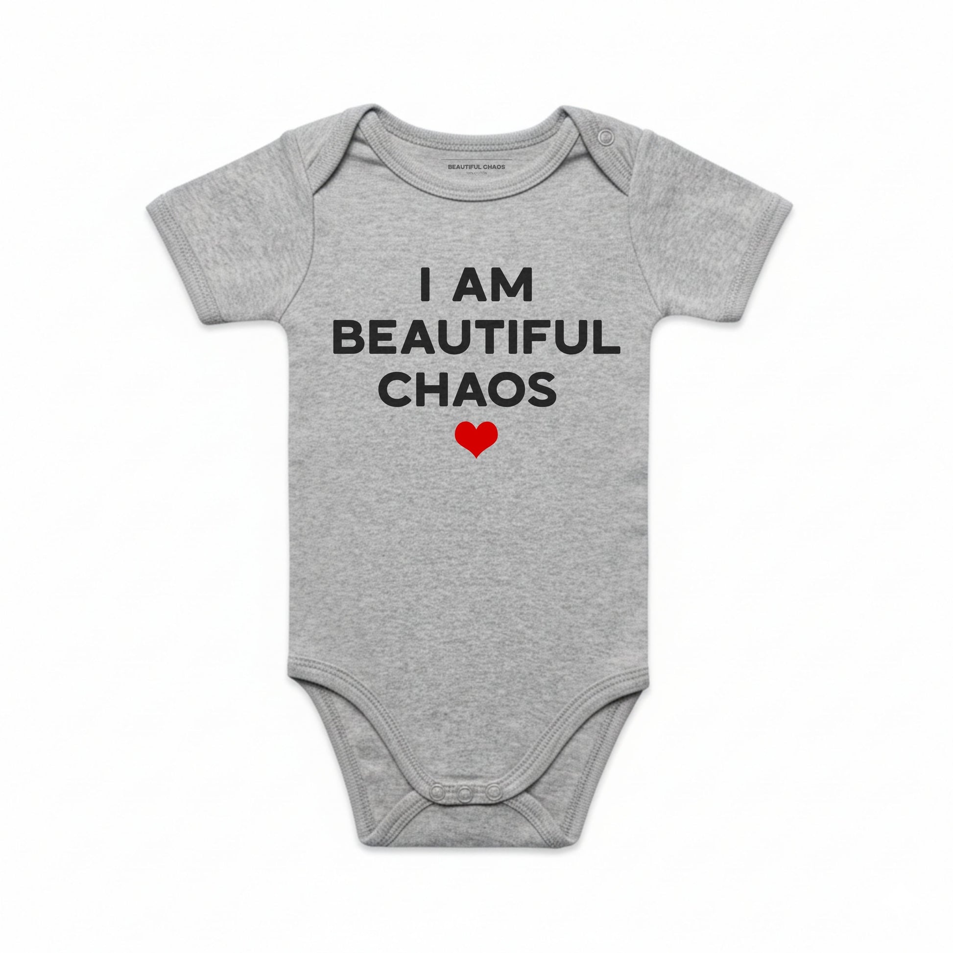 Gray baby onesie with text 'I AM BEAUTIFUL CHAOS' and a red heart