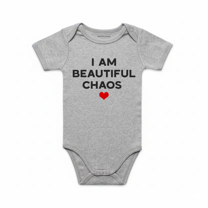 Gray baby onesie with text 'I AM BEAUTIFUL CHAOS' and a red heart